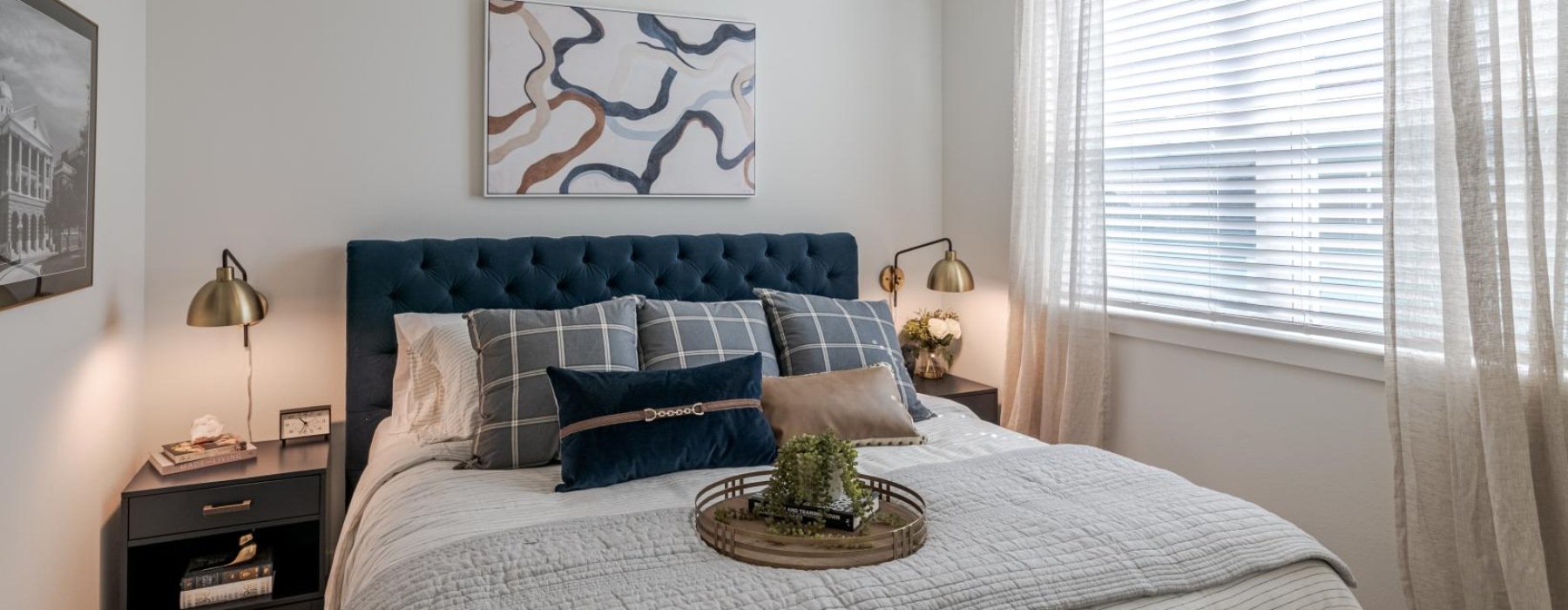 a bedroom with a fan and a bed