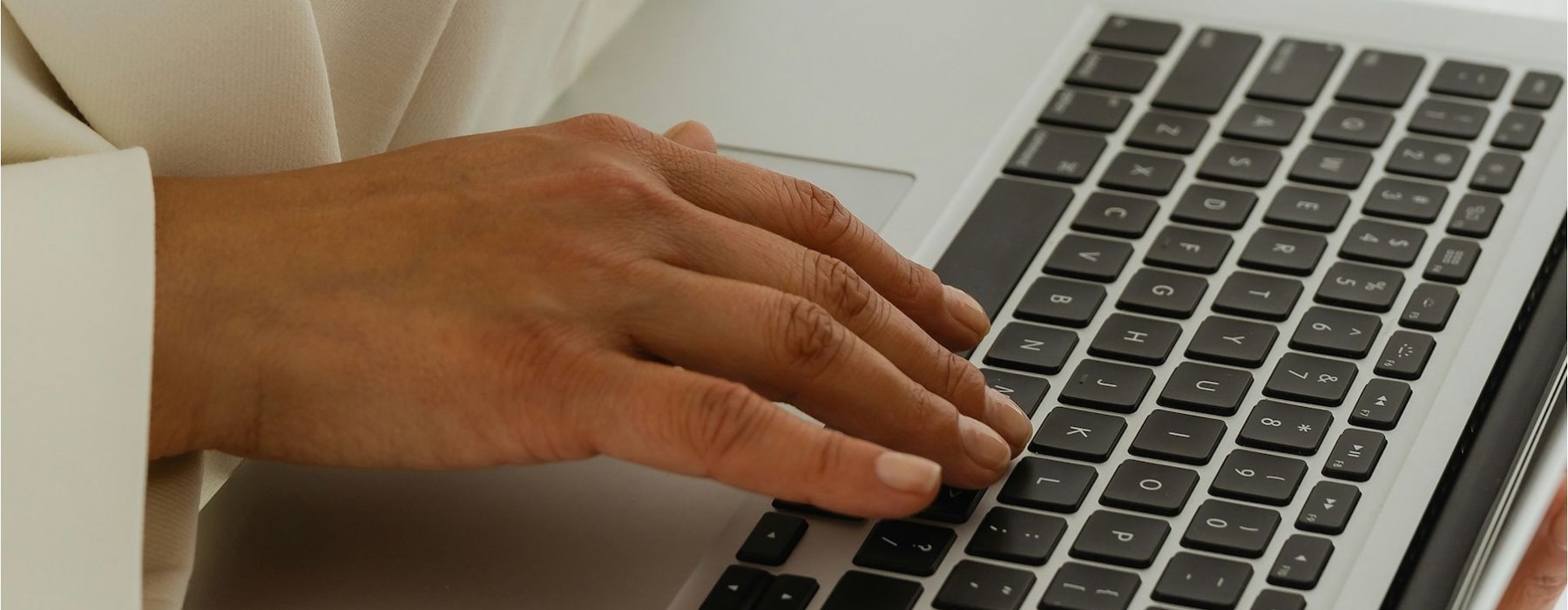 a person typing on a laptop