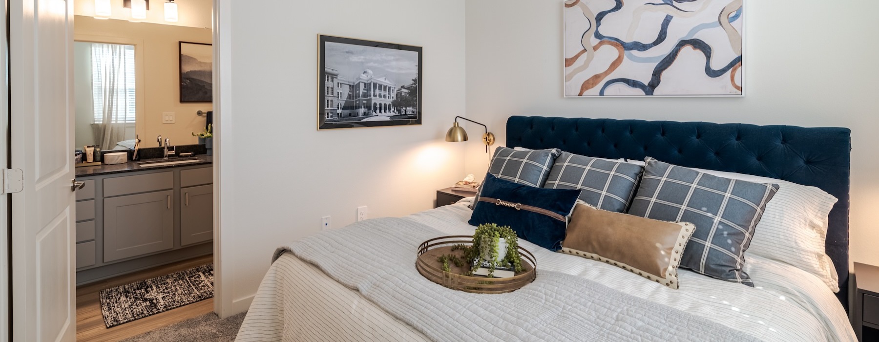 a bedroom with a bed and a fan